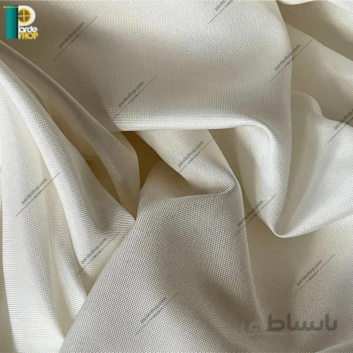 آستر پرده لطیف براق رنگ شیری روشن همراه دوخت و نوار