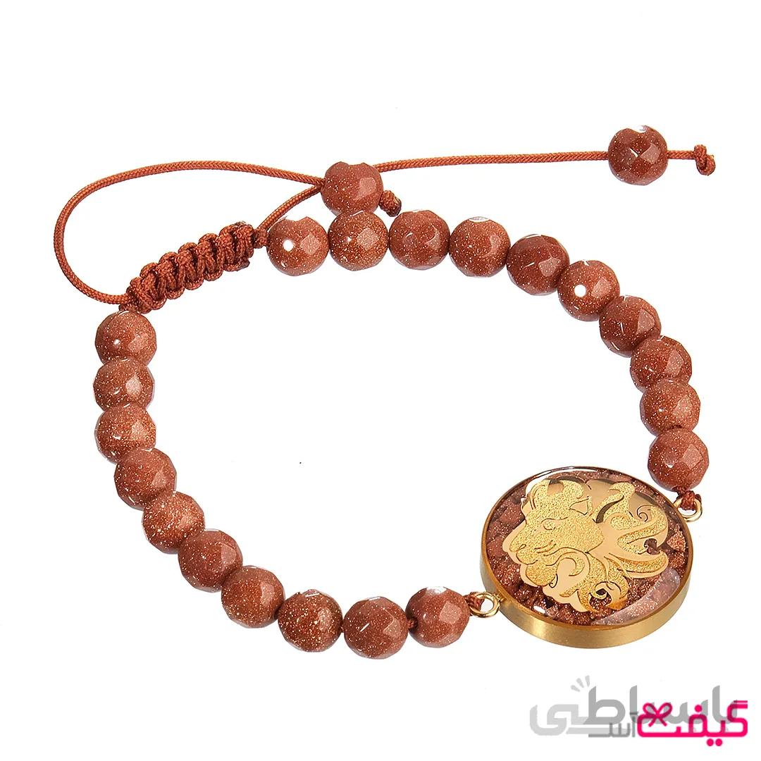 دستبند سنگ دلربا و ورق طلا ماه مرداد