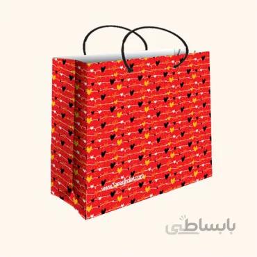 ساک کادویی متوسط عرضی سایز 4 طرح قلب های ریز سیاه، قرمز، زرد