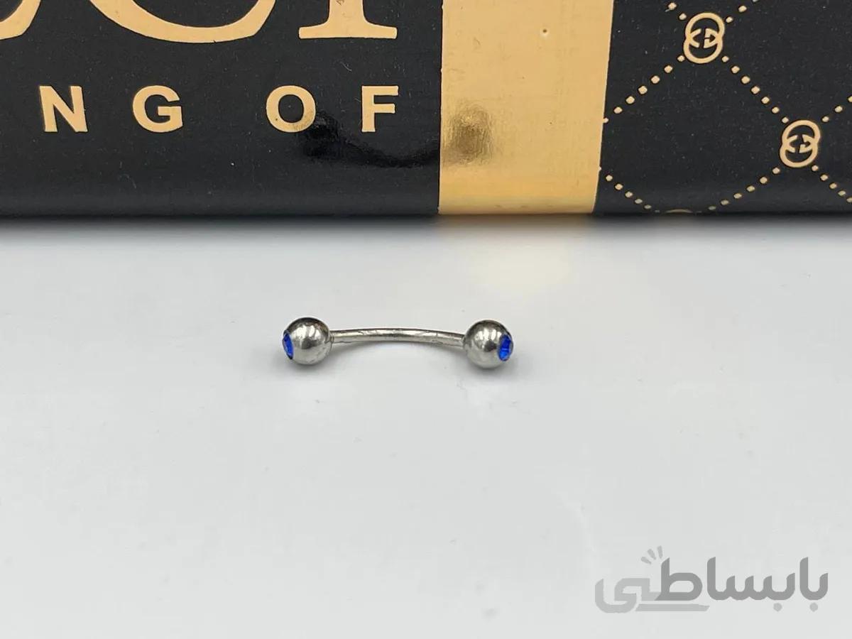 پیرسینگ ابرو و نواحی دیگر با نگین آبی