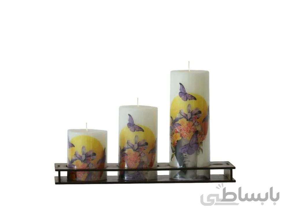 ست کامل شمع استوانه ای سفید ترانسفر پروانه در سه ارتفاع 15-10-7 ا Complete set of cylindrical candles with a diameter of 5.5 cm in crimson color in three heights of 10-15-7