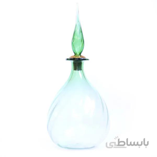 بطری شیشه ای موجدار در نیزه ای بلند سبز