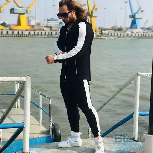 ست مردانه کد 026 هودی و شلوار طرح تک خط جنس دورس رنگ مشکی ا Men's set made of full-length Dors