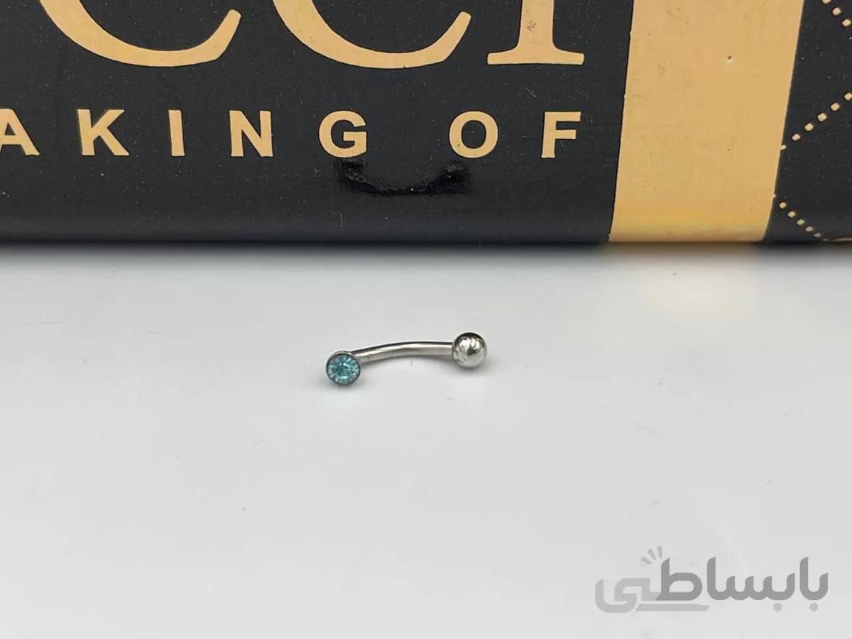 پیرسینگ ابرو و گردن با نگین آبی