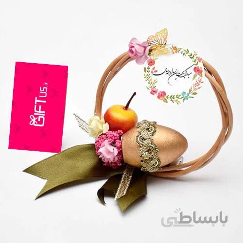 حلقه چوبی با تخم مرغ سفالی