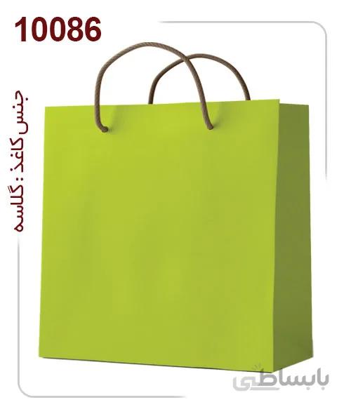 ساکدستی فانتزی تک رنگ سبز با کاغذ گلاسه کد10086