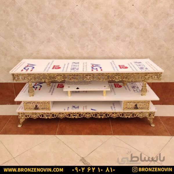 میز تلویزیون برنزی صفحه هایگلاس سفید تسمه گل رز سنگین