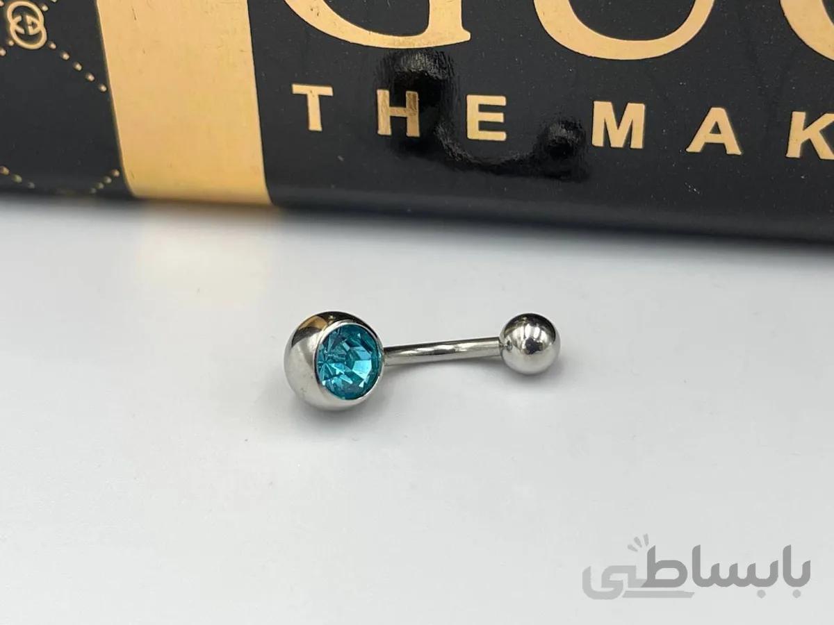 پیرسینگ ناف با کریستال آبی