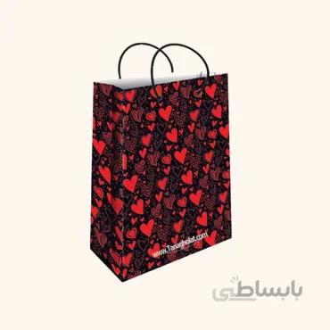 ساک کادویی متوسط طولی سایز 3 طرح گل قرمز با زمینه مشکی