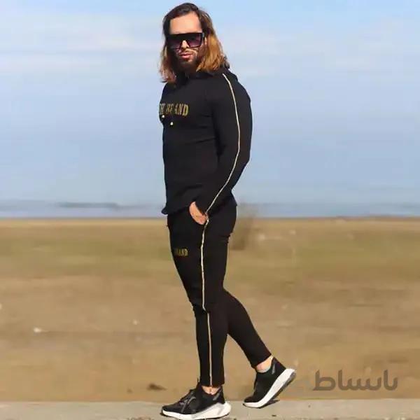 ست مردانه کد 228 هودی و شلوار طرح بغل زیپ دار طلایی رنگ مشکی ا Men's set, code 228, hoodie and pants with black zipper design
