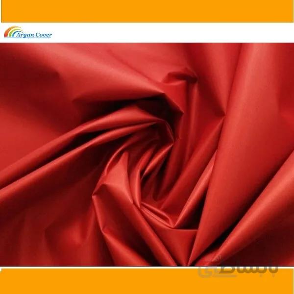 پارچه شمعی قرمز پشت نقره ای عرض 150