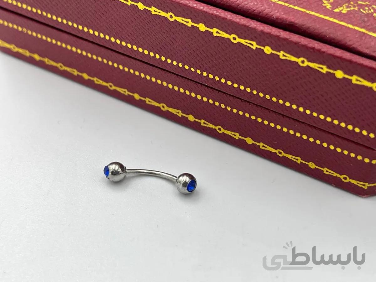پیرسینگ ابرو و نیپل با نگین های آبی