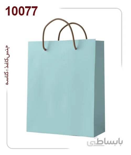 ساکدستی فانتزی تک رنگ آبی با کاغذ گلاسه کد10077