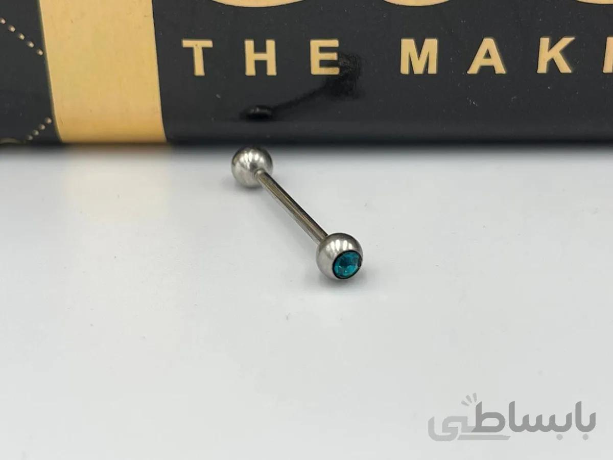 پیرسینگ لپ و زبان با نگین آبی