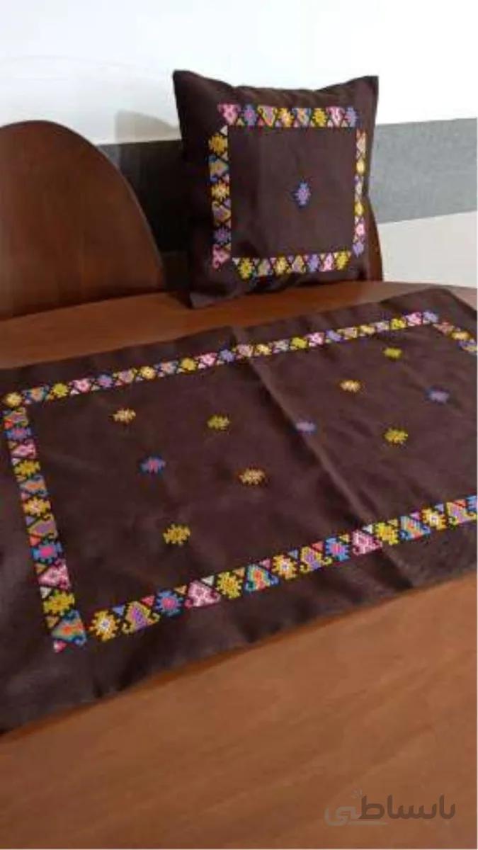 یک رومیزی ودوعدد کوسن بلوچی دوزی دست دوز ا A tablecloth and two hand-embroidered Baluchi cushions
