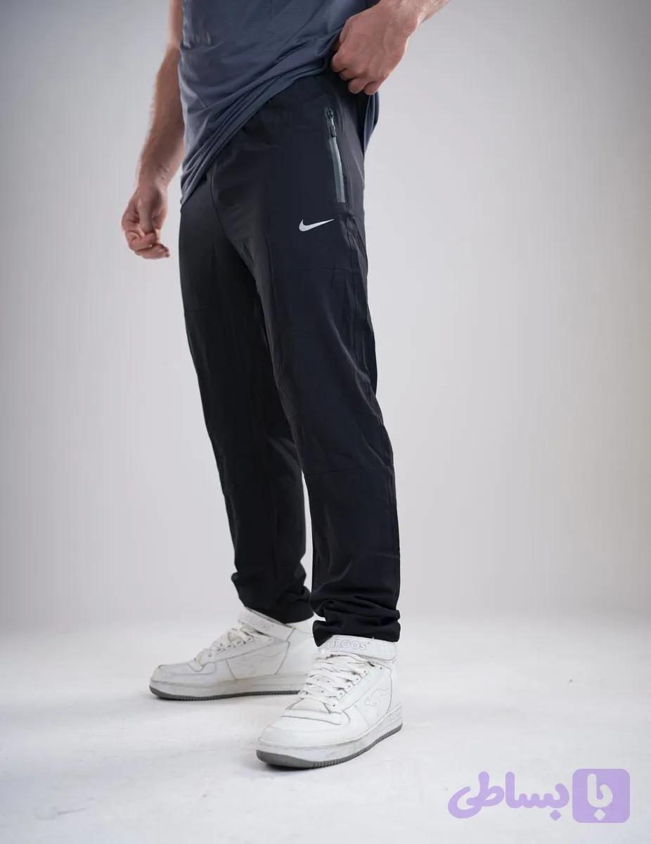 شلوار ورزشی مردانه (راسته) مدل NIKE پارچه آیرو درجه یک جیب دار دارای زیپ سبک و خنک در 3 رنگ جذاب
