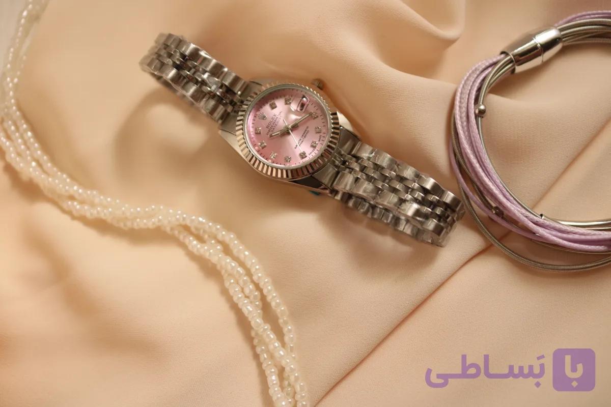 ساعت مچی زنانه رولکس رنگ صفحه صورتی ملایم ، تاریخ شمار ، باتری قابل تعویض ، استیل درجه یک ، قفل کلیپسی