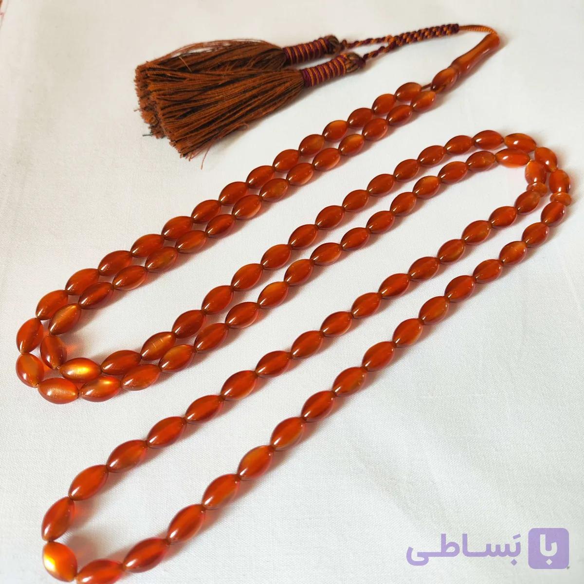 تسبیح کهربا پودری زرافشان 101 عددی رنگ نارنجی تراش دقیق و خوشدست