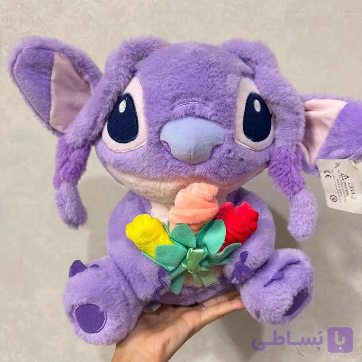 عروسک استیج بنفش گل به دست💜