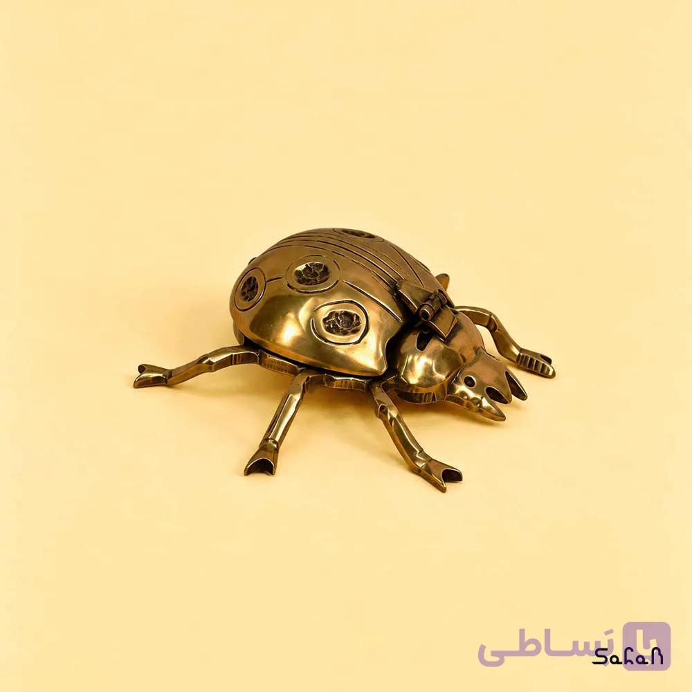 زیرسیگاری برنجی مدل کفش دوزک در دار — تصویر 1