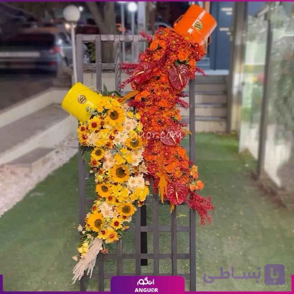 تاج گل تبریک آبشاری (آفتابگردان،داوودی،رزمینیاتوری،آنتوریوم) — تصویر 1