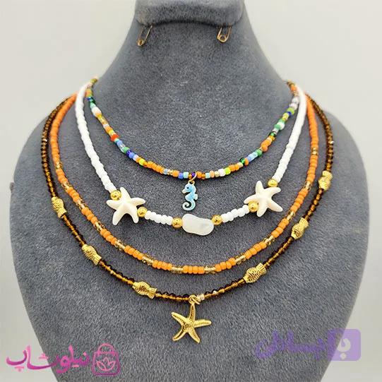 گردنبند دخترانه دستساز 4 لاین مدل ستاره دریایی تناژ نارنجی کد 560