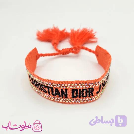 دستبند دخترانه پارچه ای کریستین دیور نگیندار نارنجی مشکی کد 150 — تصویر 1