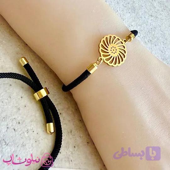 دستبند زنانه آسانسوری بندی مشکی با پلاک طلایی مدل خورشید کد 159