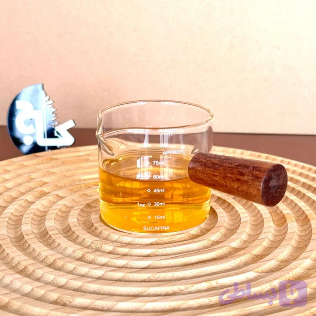 پیمانه شیشه ای دسته چوب