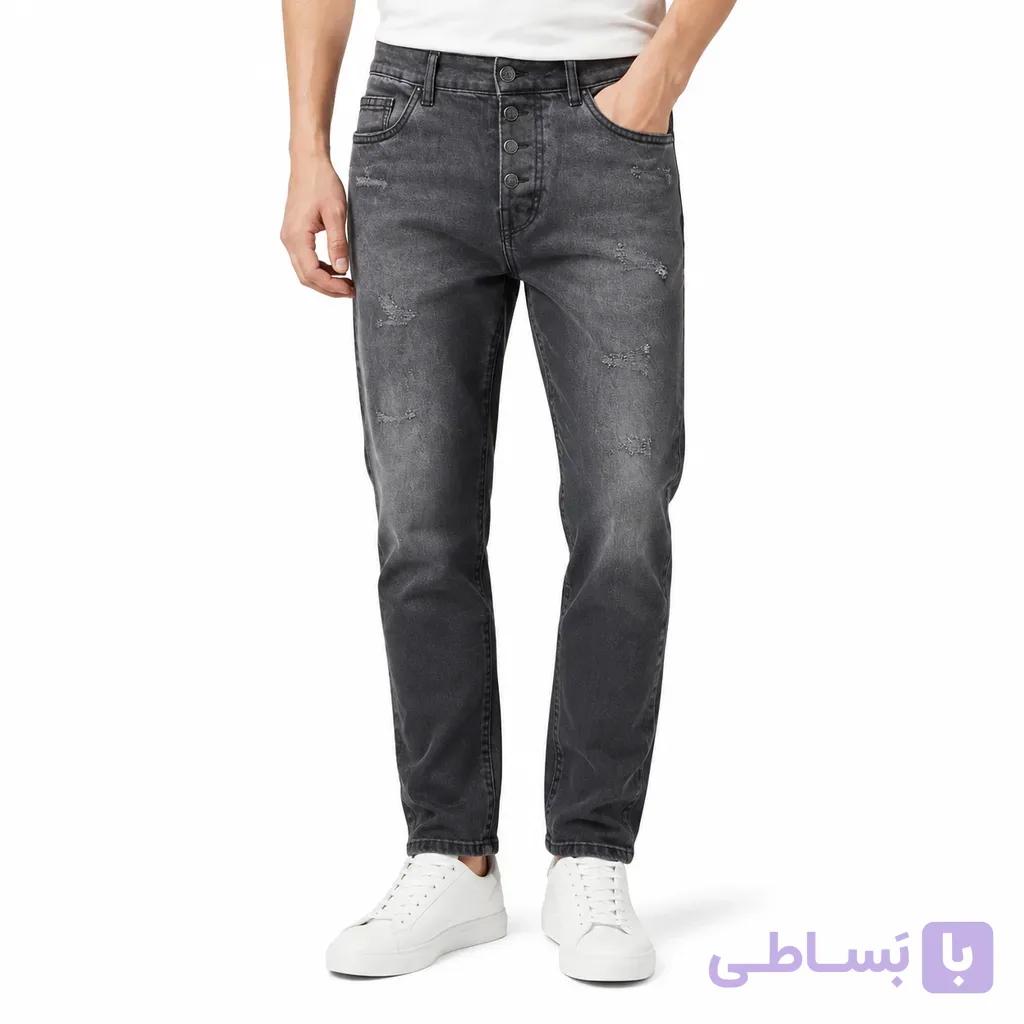 شلوار جین تیپرد مردانه  قواره راسته‌گشاد با پارگی ظریف و دمپای جمع — تصویر 1