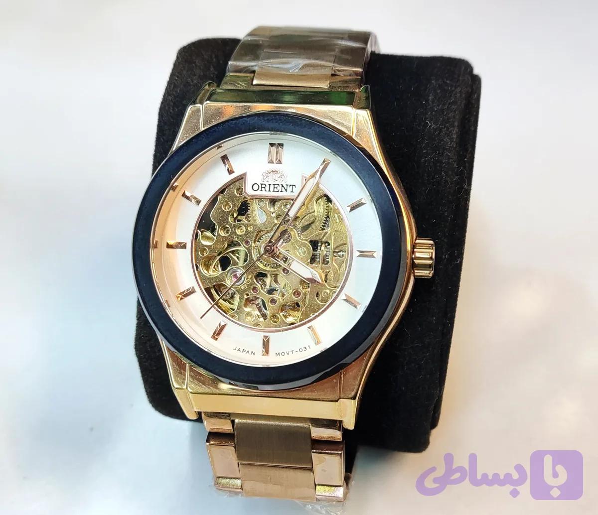 ساعت مچی مردانه ORIENT اورینت فلزی اتوماتیک مکانیکی درب پشت شیشه ای بند و قاب رزگلد صفحه سفید اسکلتون موتور پیدا کد 031