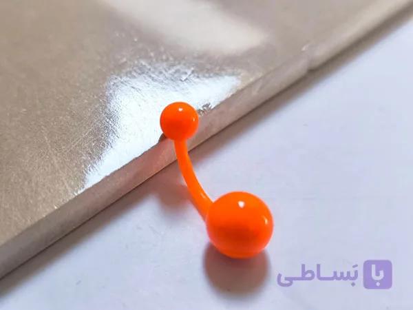 پیرسینگ ناف پلاستیکی نارنجی — تصویر 1