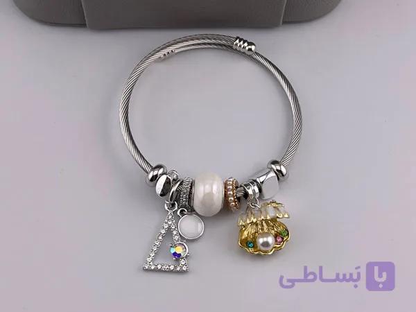 دستبند نقره ای چارم با طرح صدف دریایی — تصویر 1