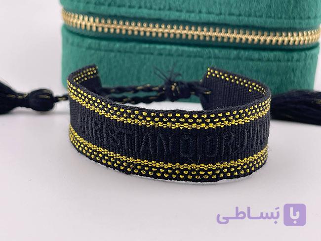 دستبند دیور مشکی و زرد با نوشته مشکی — تصویر 1