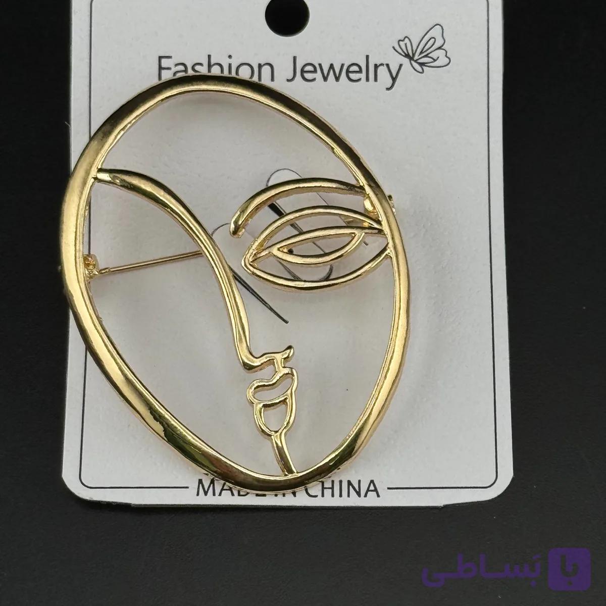 سنجاق سینه طرح چهره مینیمال طلایی — تصویر 1