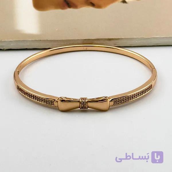 دستبند ژوپینگ النگویی طلایی با پاپیون نگین‌دار — تصویر 1