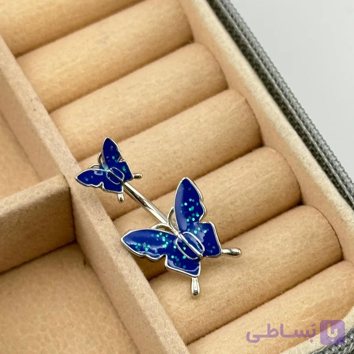 پیرسینگ ناف طرح پروانه آبی اکلیلی — تصویر 1