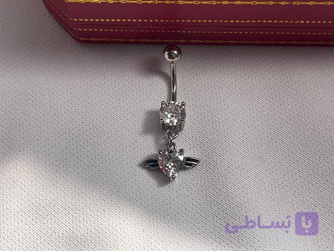 پیرسینگ ناف طرح قلب و مال — تصویر 1