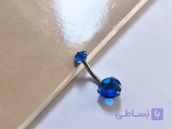 پیرسینگ ناف آبی دو سرنگین — تصویر 1