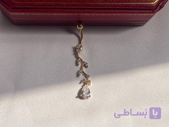 پیرسینگ ناف طرح شاخه ای همراه با نگین کاری — تصویر 1