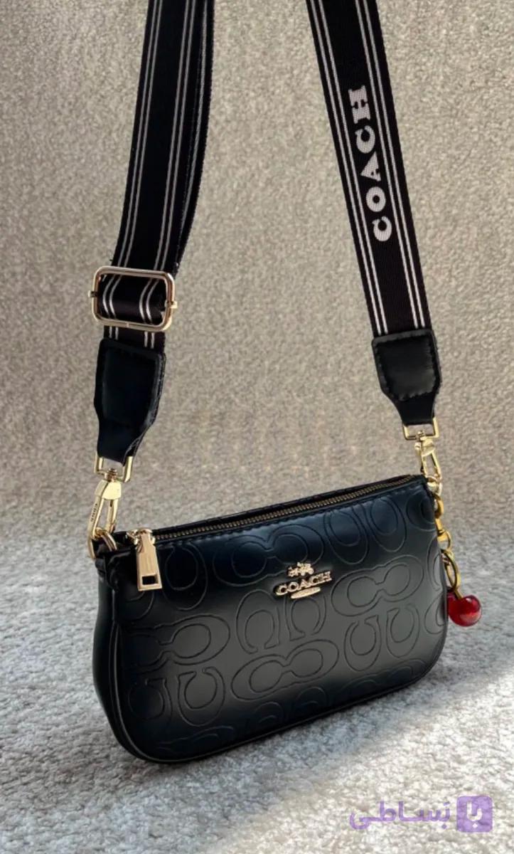 کیف دخترانه دوشی پاسپورتی طرح کوچ (Coach) جنس چرم مصنوعی خارجی