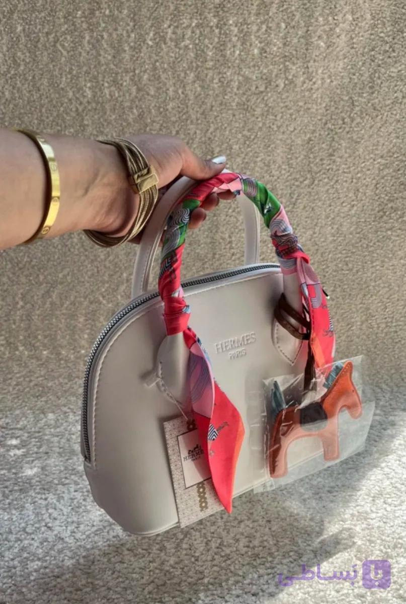 کیف دخترانه دستی / دوشی مدل نیم گرد طرح هرمس (hermes) جنس چرم مصنوعی خارجی