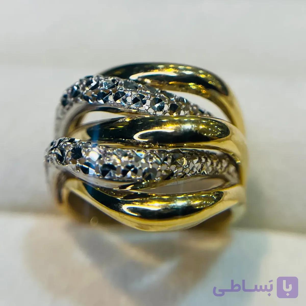 انگشتر طلا 18 عیار مارپیچی دورنگ تراش وزن 4.750 گرم اجرت ساخت ۹ درصد کد GD01 000292