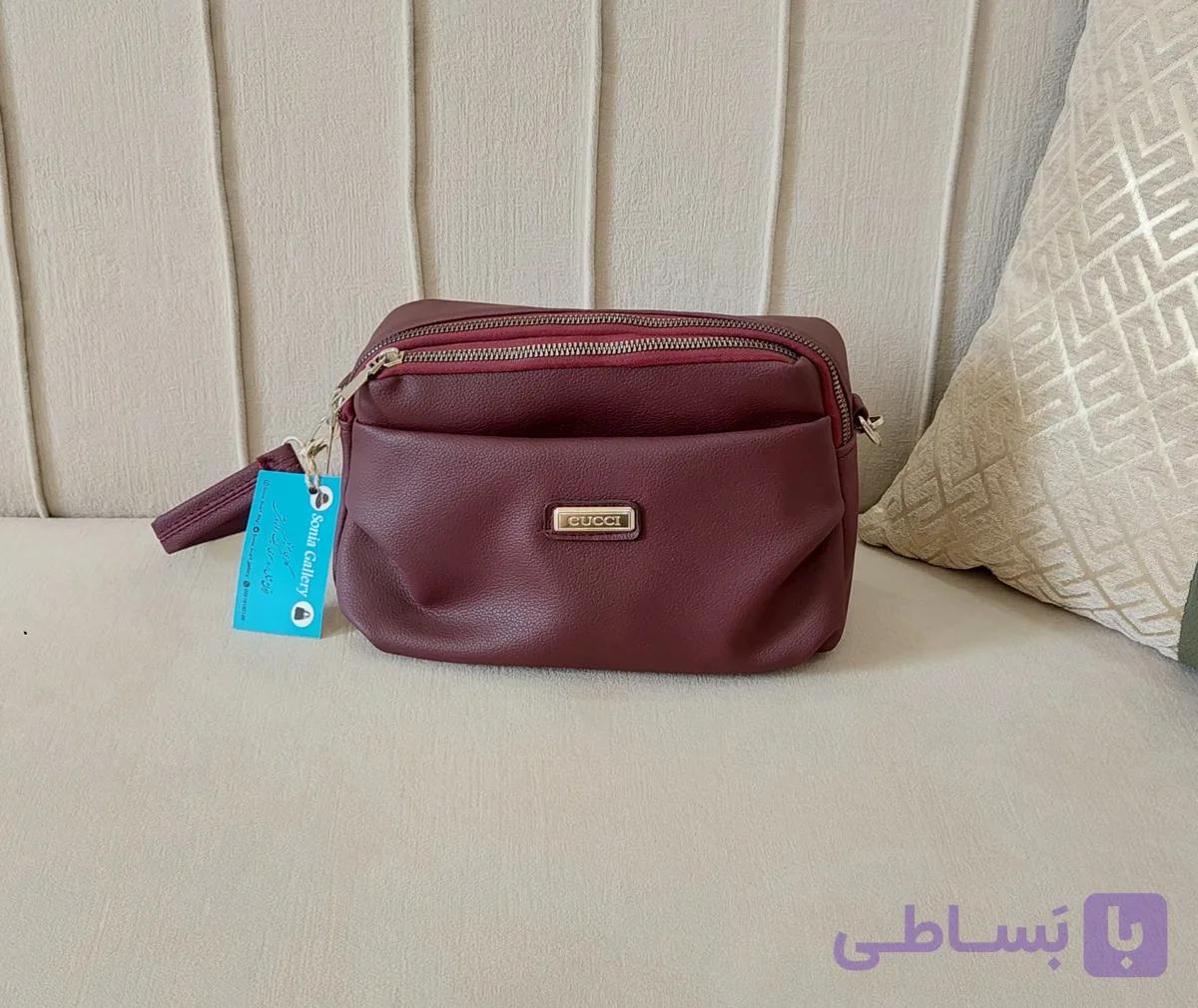 کیف دخترانه جنس چرم‌مصنوعی رنگ زرشکی