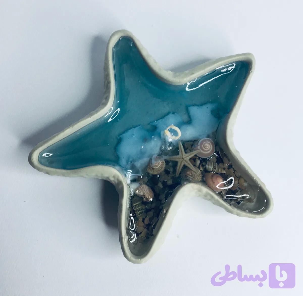 شمع فانتزی طرح دریا با ظرف ستاره دریایی سنگی و پارافین ژله ای دست ساز