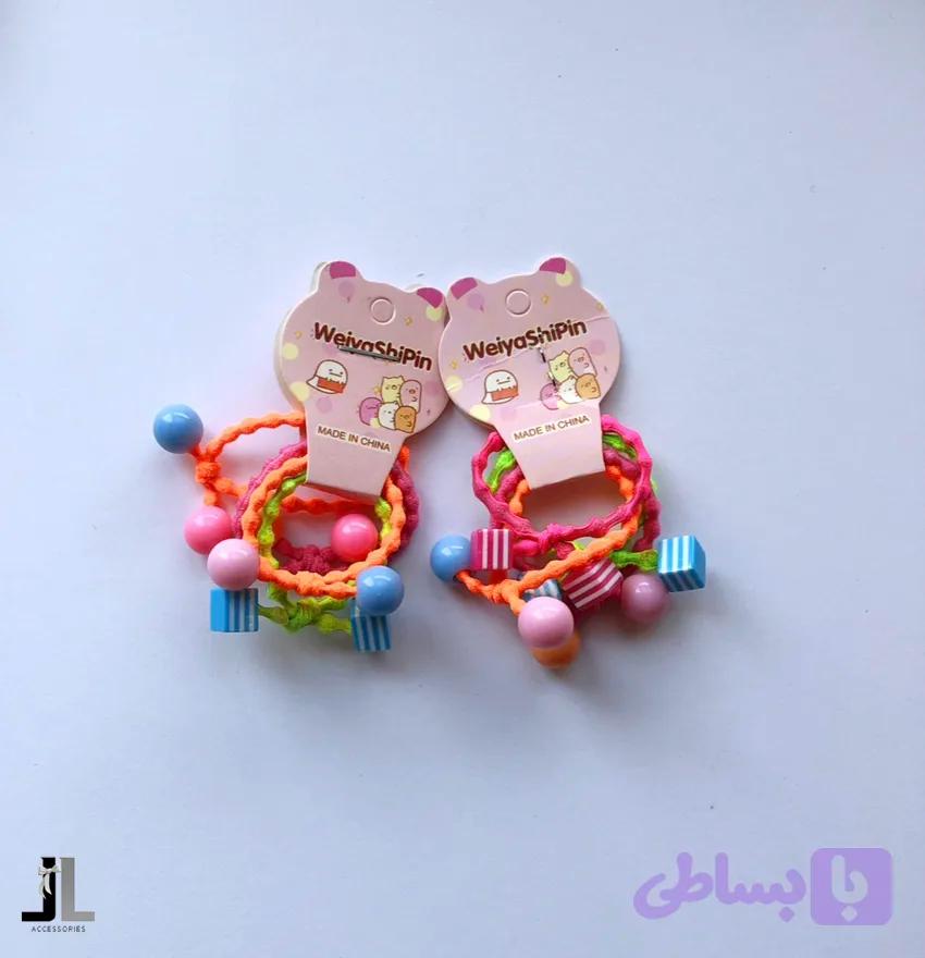 پک کش مو‌ رنگی مهره دار — تصویر 1